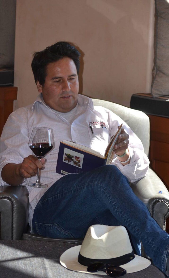 Enjoying wine with a good book