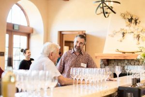 CFO/COO Bob with wine club member in member parlor